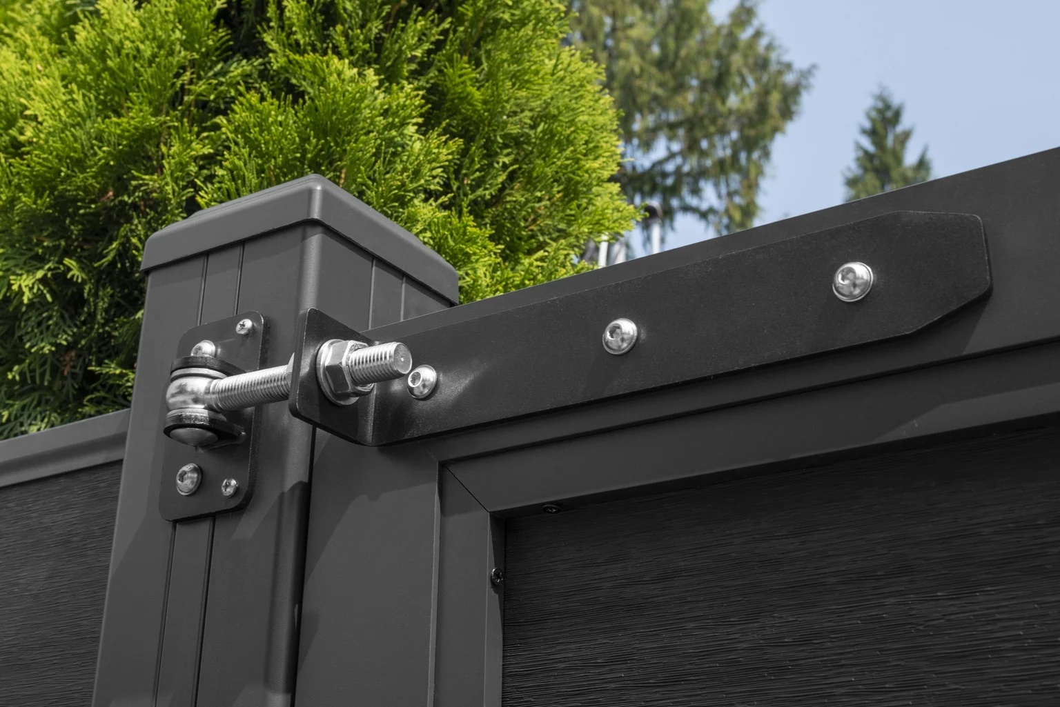 Close view of the gate hinge and matching composite post at Garrow