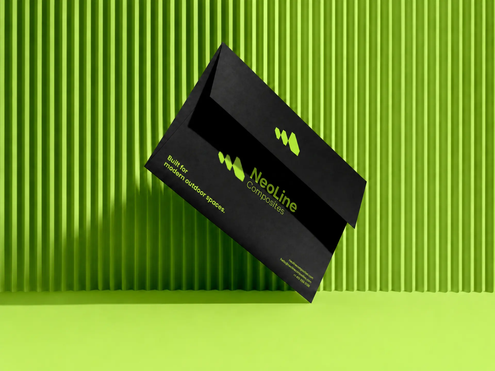 Black NeoLine Composites presentation folder with lime wordmark on a fluted green backdrop